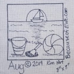 A beach scene with a bucket, shovel, beach ball on the sand with a sailboat on the horizon in front of the sun.