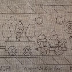 Rug Hooking pattern of a train full of sweet treats.