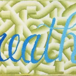 Hooked rug showing the color grasshopper, a yellow-green wool.