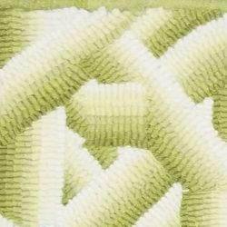 Grasshopper wool, a yellow/green, hooked into a background of a rug.